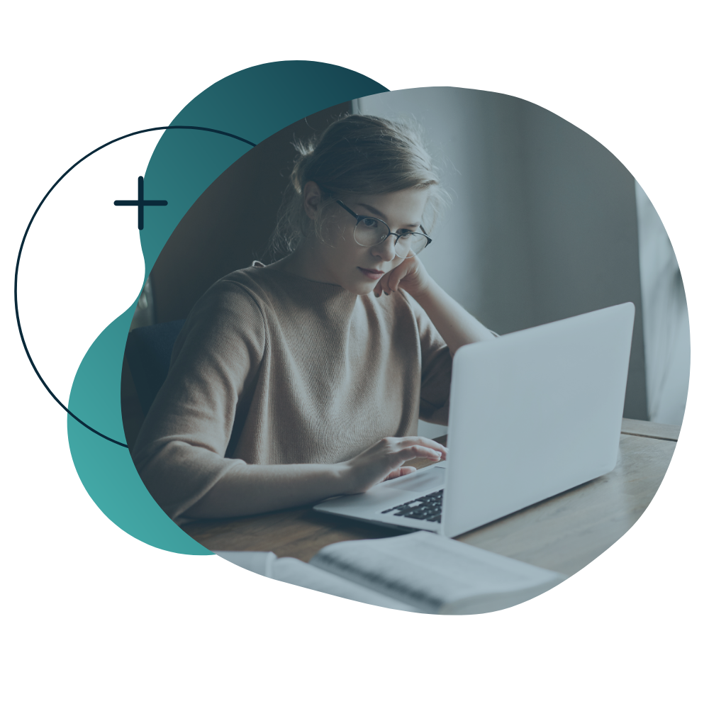 woman with glasses using tablet